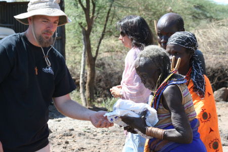 Paul giving bags of dehydrated food to the people of East Pokot