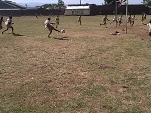 boys playing soccer at the school